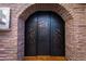 Unique metal door with a decorative cutout design, adding character to the home at 35931 N 82Nd Pl, Scottsdale, AZ 85266