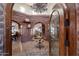 Grand entry with arched doorways and chandelier at 35931 N 82Nd Pl, Scottsdale, AZ 85266