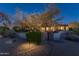 Night view of home with landscaped yard and lighting at 35931 N 82Nd Pl, Scottsdale, AZ 85266