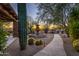 Stone pathway leads to fountain and sunset view at 35931 N 82Nd Pl, Scottsdale, AZ 85266