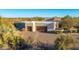 Exterior view of luxury home with double garage and desert landscaping at 35931 N 82Nd Pl, Scottsdale, AZ 85266
