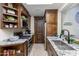 Modern kitchen with granite countertops and wooden cabinetry at 35931 N 82Nd Pl, Scottsdale, AZ 85266