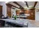 Gourmet kitchen boasts granite counters and rich wood cabinets at 35931 N 82Nd Pl, Scottsdale, AZ 85266