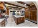 Spacious kitchen with large island, granite countertops, and high-end appliances at 35931 N 82Nd Pl, Scottsdale, AZ 85266