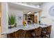 Breakfast bar with granite countertop and two chairs at 35931 N 82Nd Pl, Scottsdale, AZ 85266