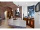 Island kitchen with granite countertops and wooden cabinetry at 35931 N 82Nd Pl, Scottsdale, AZ 85266