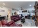 Open living area with red leather couches and a workspace at 35931 N 82Nd Pl, Scottsdale, AZ 85266