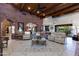 Open living area with high ceilings, stone accents, and access to backyard at 35931 N 82Nd Pl, Scottsdale, AZ 85266