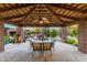 Covered patio with dining table and chairs, overlooking the pool at 35931 N 82Nd Pl, Scottsdale, AZ 85266