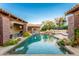Relaxing pool area with waterfall feature and patio seating at 35931 N 82Nd Pl, Scottsdale, AZ 85266