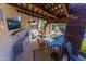 Outdoor kitchen and bar area with a view of the pool at 35931 N 82Nd Pl, Scottsdale, AZ 85266