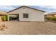 Gravel backyard with covered patio and grill at 3908 S 78Th Ln, Phoenix, AZ 85043