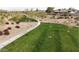 Lush community green space with walking path and desert landscaping features at 3908 S 78Th Ln, Phoenix, AZ 85043