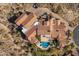 Aerial view of a sprawling estate with a pool and mountain views at 4362 N Diamond Point Cir, Mesa, AZ 85207