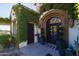 Ornate wrought iron door entry with lush landscaping at 4362 N Diamond Point Cir, Mesa, AZ 85207