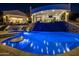 Luxury pool with a slide and spa at night at 4362 N Diamond Point Cir, Mesa, AZ 85207