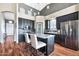 Bright kitchen with island, high ceilings, and dark cabinetry at 4829 E Armor St, Cave Creek, AZ 85331