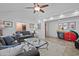 Living room boasts gray sofas, a glass coffee table, and large windows at 6164 E Minton Pl, Mesa, AZ 85215