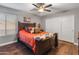 Guest bedroom with wood floors and built in closet at 6614 S Cottonfields Ln, Laveen, AZ 85339