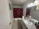 Bathroom with single sink vanity and Arizona Cardinals shower curtain at 706 N 4Th St # 2, Avondale, AZ 85323