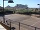 Two lighted tennis courts with mountain views at 11988 N 136Th Way, Scottsdale, AZ 85259