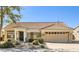 Charming one-story home with terracotta tile roof and well-manicured landscaping at 14737 W Colt Ln, Sun City West, AZ 85375