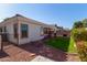 Landscaped backyard with patio and grass at 17388 W Navajo St, Goodyear, AZ 85338