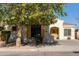 One-story home with yellow door and shutters, landscaped yard at 17388 W Navajo St, Goodyear, AZ 85338