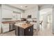 Spacious kitchen with island, stainless steel appliances, and light-colored cabinetry at 17388 W Navajo St, Goodyear, AZ 85338