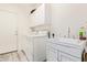 Laundry room with washer, dryer, and utility sink at 17388 W Navajo St, Goodyear, AZ 85338