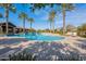 Resort-style pool with palm trees and lounge chairs at 22915 E Quintero Rd, Queen Creek, AZ 85142