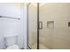 Clean bathroom with a glass shower and neutral tile at 28409 N 59Th Way, Cave Creek, AZ 85331