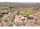 Expansive aerial view of a luxury neighborhood with modern homes, a golf course, and desert landscape at 3703 S Avenida De Angeles --, Gold Canyon, AZ 85118