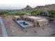 Desert home with a sleek pool, bordered by a golf course, offering a blend of recreation and serene living at 3703 S Avenida De Angeles --, Gold Canyon, AZ 85118