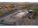 Aerial view of a desert property with a modern home design and a pool, capturing the essence of luxury living at 3703 S Avenida De Angeles --, Gold Canyon, AZ 85118