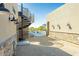 Backyard view showcasing a spiral staircase, stucco wall and access to the pool and outdoor area at 3703 S Avenida De Angeles --, Gold Canyon, AZ 85118