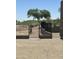 Private backyard featuring desert landscaping, a secure fence, and views of the lush golf course at 3703 S Avenida De Angeles --, Gold Canyon, AZ 85118