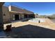 Large, unfinished backyard with a patio, sliding glass doors, and pool being built at 3703 S Avenida De Angeles --, Gold Canyon, AZ 85118