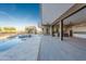 Expansive covered patio with outdoor kitchen, connected to the backyard pool and spa at 3703 S Avenida De Angeles --, Gold Canyon, AZ 85118