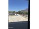 View of the backyard featuring a pool and spa overlooking mountain views through the sliding glass door at 3703 S Avenida De Angeles --, Gold Canyon, AZ 85118
