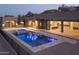 Stunning backyard with modern pool, spa, and outdoor kitchen, ideal for entertaining and relaxation at 3703 S Avenida De Angeles --, Gold Canyon, AZ 85118