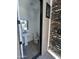 Stylish bathroom with a modern pedestal sink, exterior stone shower and sleek black trim at 3703 S Avenida De Angeles --, Gold Canyon, AZ 85118