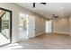 Spacious bedroom features wood-look tile flooring, recessed lighting, and a sliding glass door at 3703 S Avenida De Angeles --, Gold Canyon, AZ 85118