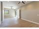 Bright bedroom features modern ceiling fan, wood-look tile flooring, and natural light at 3703 S Avenida De Angeles --, Gold Canyon, AZ 85118