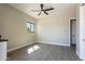 Bedroom with wood-look tile, ceiling fan, mini-split AC, and window with exterior views at 3703 S Avenida De Angeles --, Gold Canyon, AZ 85118