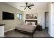 Cozy bedroom with modern decor, stylish furnishings, and a mounted TV, perfect for relaxation and restful nights at 3703 S Avenida De Angeles --, Gold Canyon, AZ 85118