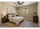 Inviting bedroom with a plush bed, dark wood accents, and soft lighting, creating a warm and relaxing retreat at 3703 S Avenida De Angeles --, Gold Canyon, AZ 85118