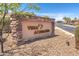 Stone entrance sign for Vista del Corazon community, showcasing natural desert landscaping and a welcoming atmosphere at 3703 S Avenida De Angeles --, Gold Canyon, AZ 85118