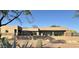 Modern home featuring a rooftop terrace, desert landscaping, and a sleek, stucco exterior at 3703 S Avenida De Angeles --, Gold Canyon, AZ 85118