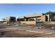 Contemporary home with desert landscaping featuring a stucco exterior, metal railing, and rooftop terrace at 3703 S Avenida De Angeles --, Gold Canyon, AZ 85118